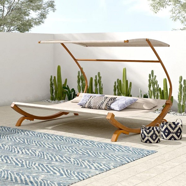 double outdoor daybed with canopy and wood base
